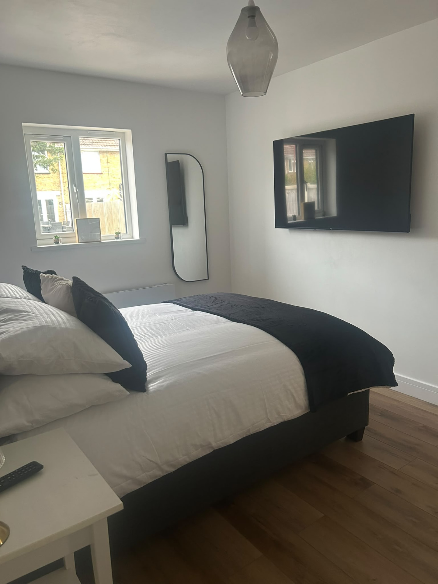First Hub 16 bedroom with wall-mounted TV